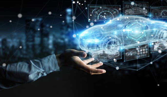 hand holding a digital image of a car schematics