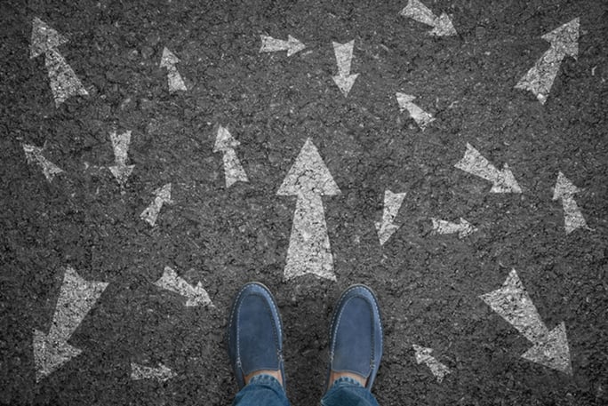 Multi-directional arrows on the ground in front of buyer